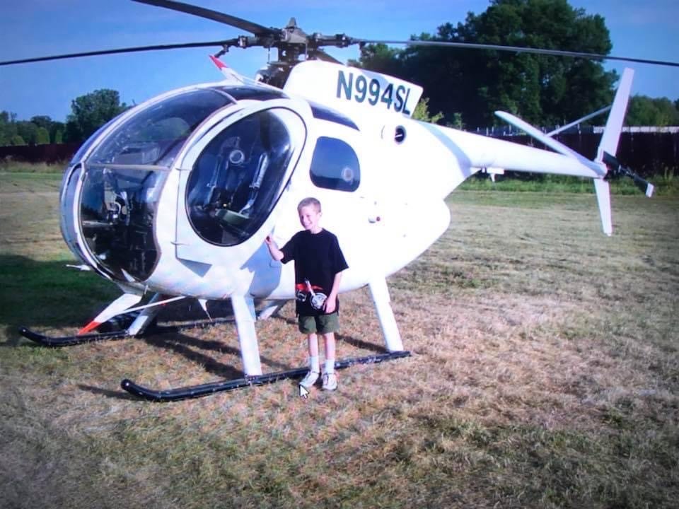 OH-6 helicopter N994SL with a young member of the GLH family