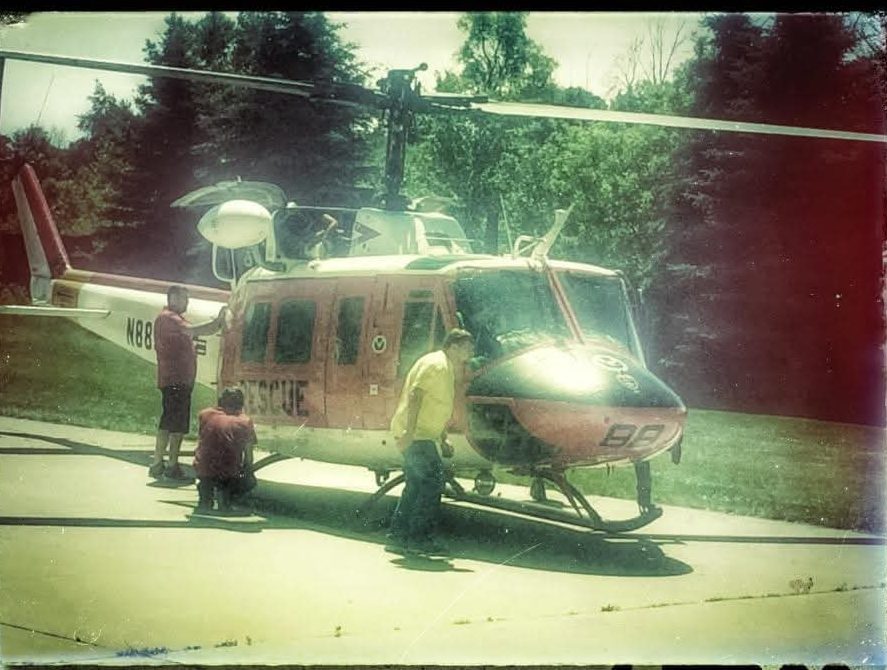 GLH technicians inspecting a rescue UH-1